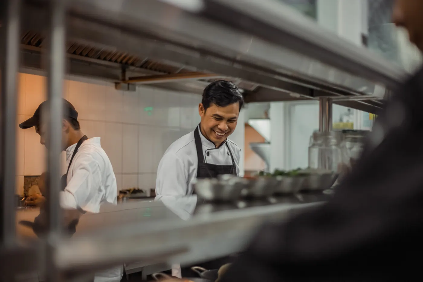 Smiling cook at the open kitchen