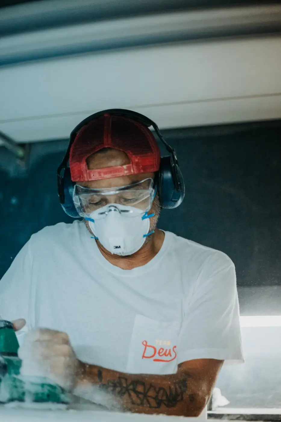 Surfboard shaper Takuya Yoshikawa at work, Deus Temple
